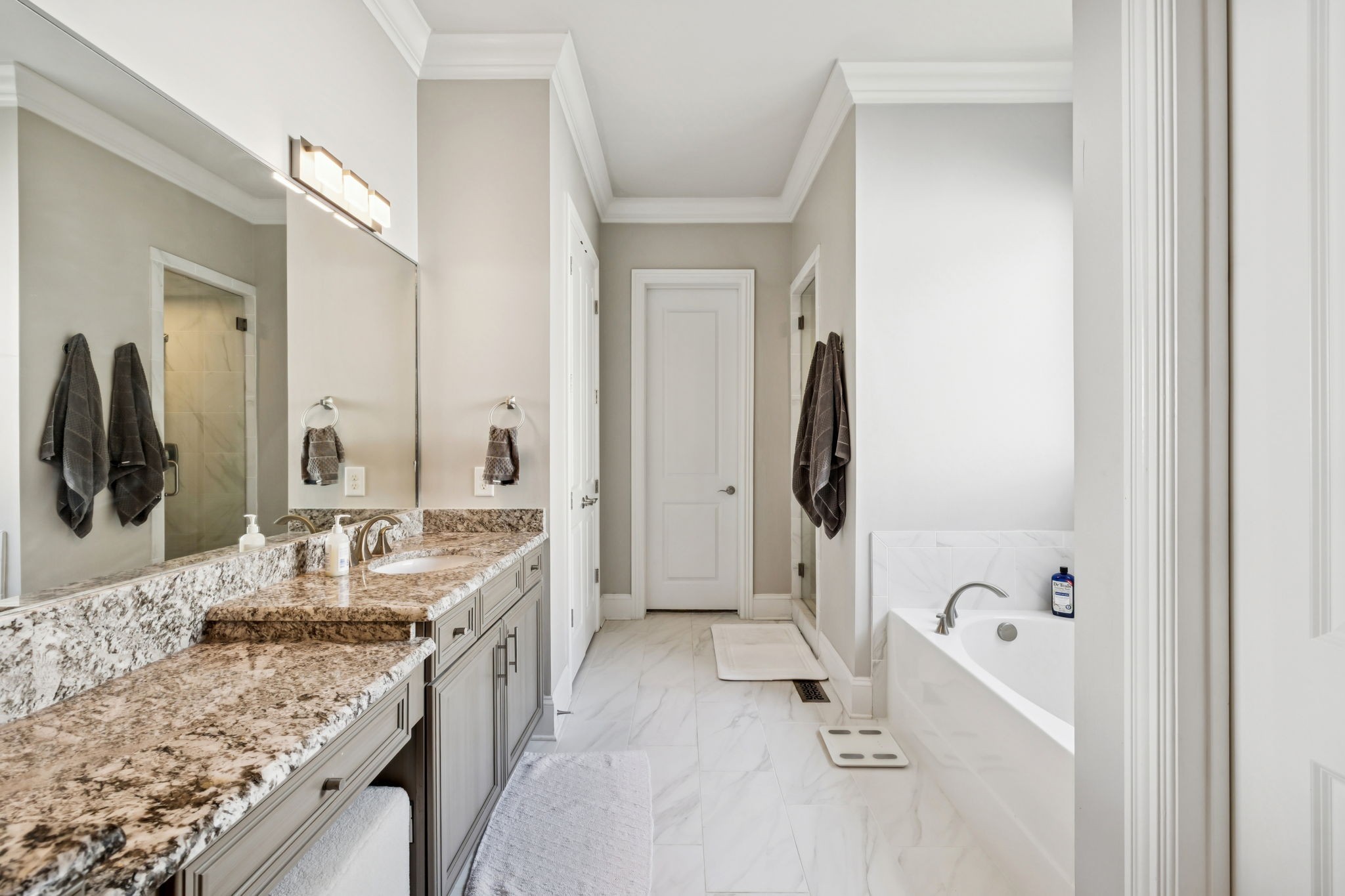 9080 Keats Street Franklin, TN 37064 - Photo 32 of 88 a bathroom with a granite countertop tub sink and mirror
