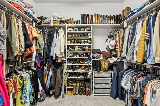 an aerial view of residential houses with outdoor space and street view