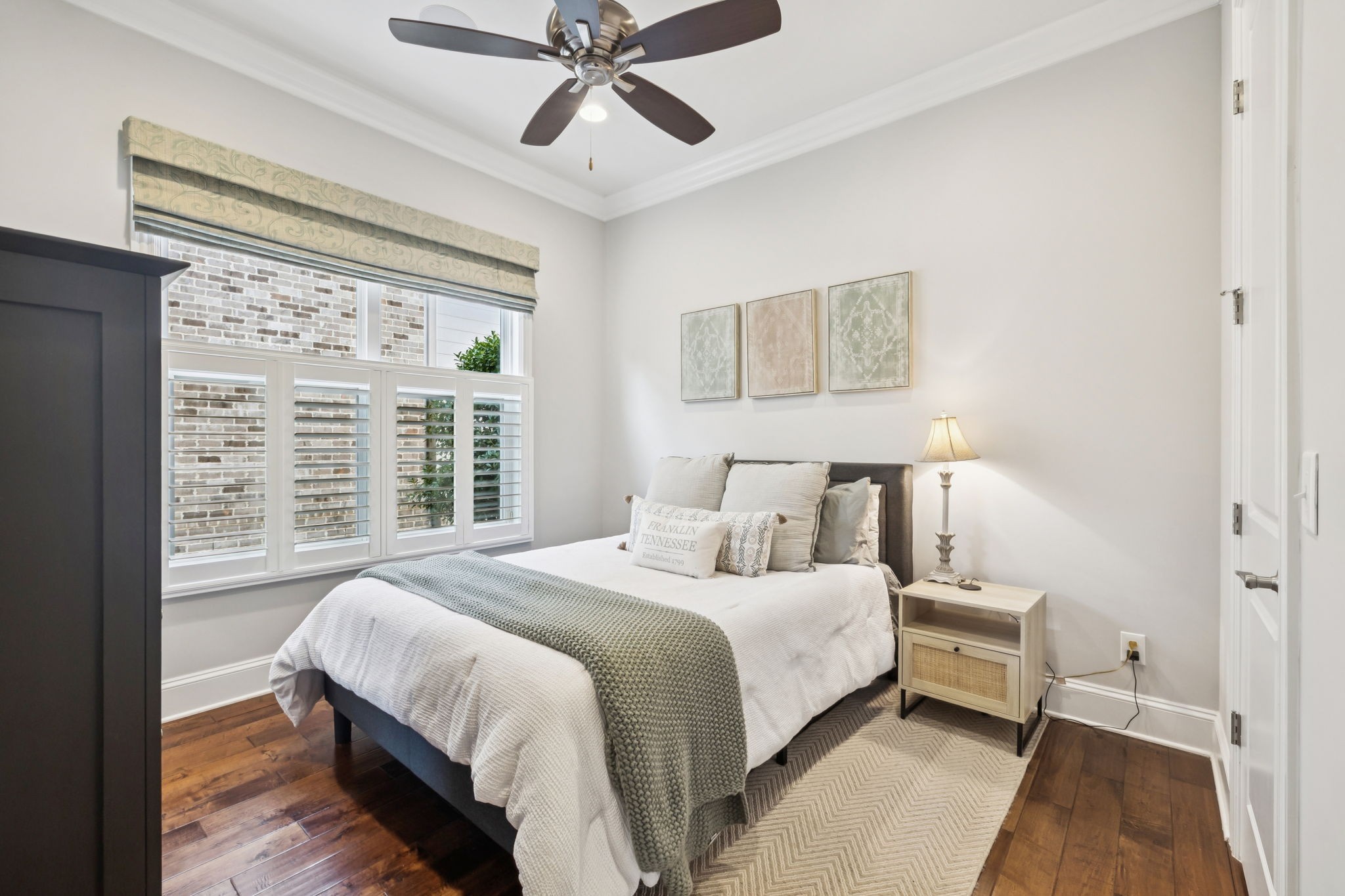 9080 Keats Street Franklin, TN 37064 - Photo 38 of 88 a bedroom with a large bed and a chandelier