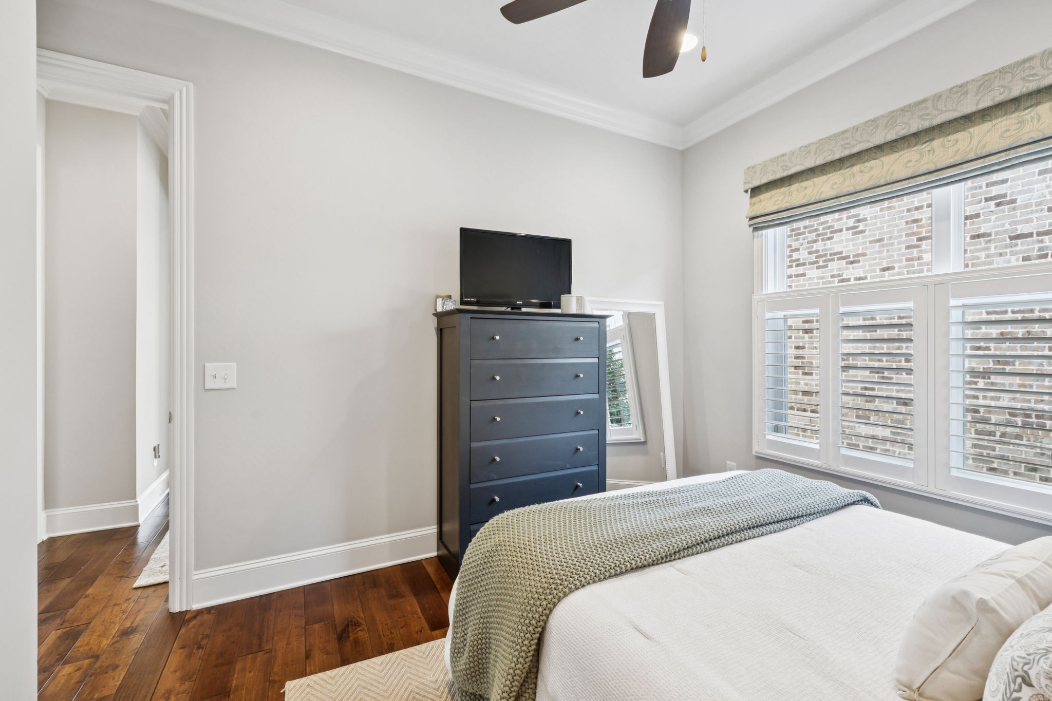 9080 Keats Street Franklin, TN 37064 - Photo 39 of 88 a bedroom with a bed and wooden floor