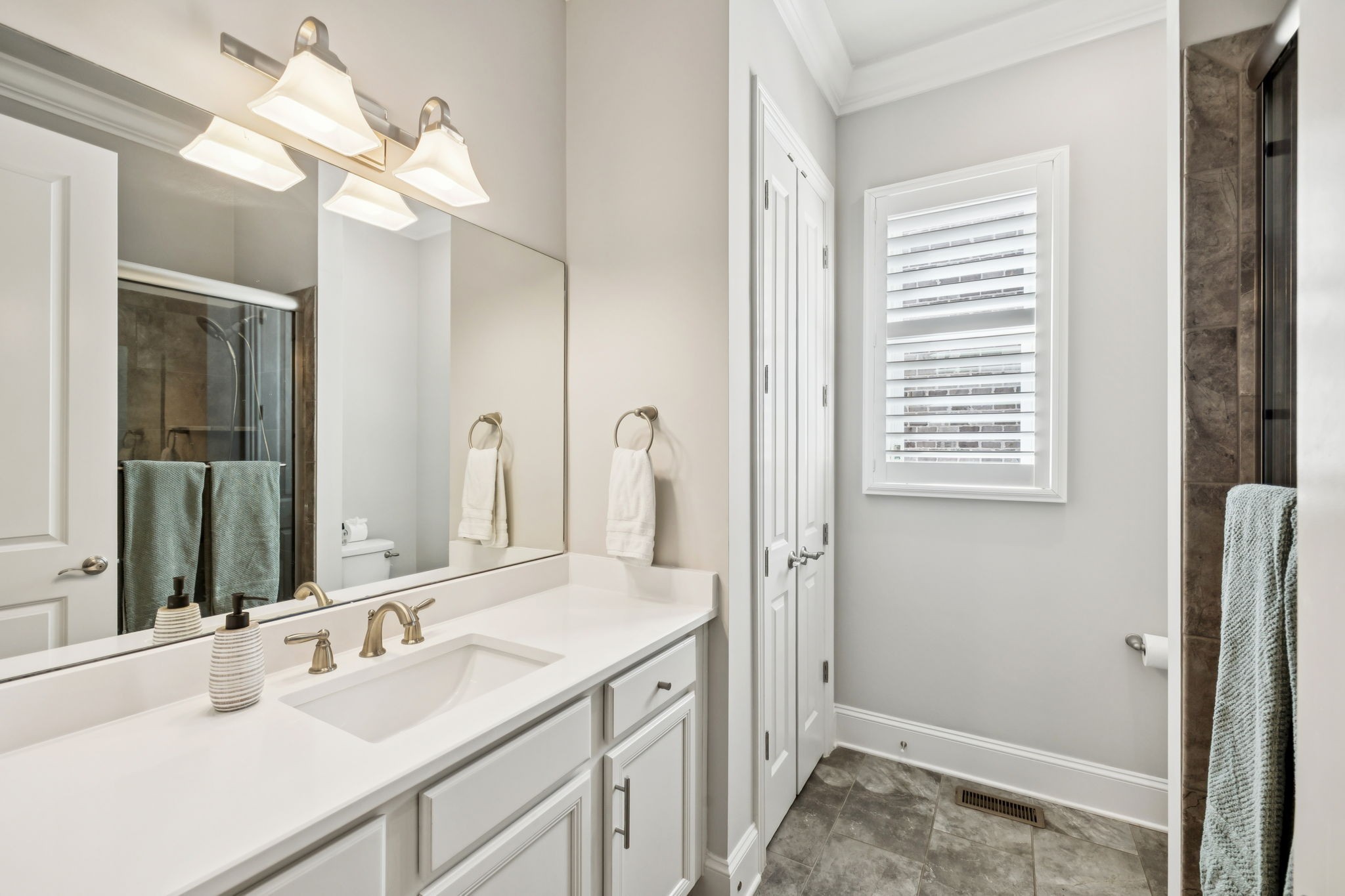 9080 Keats Street Franklin, TN 37064 - Photo 40 of 88 a bathroom with a sink vanity granite and a mirror