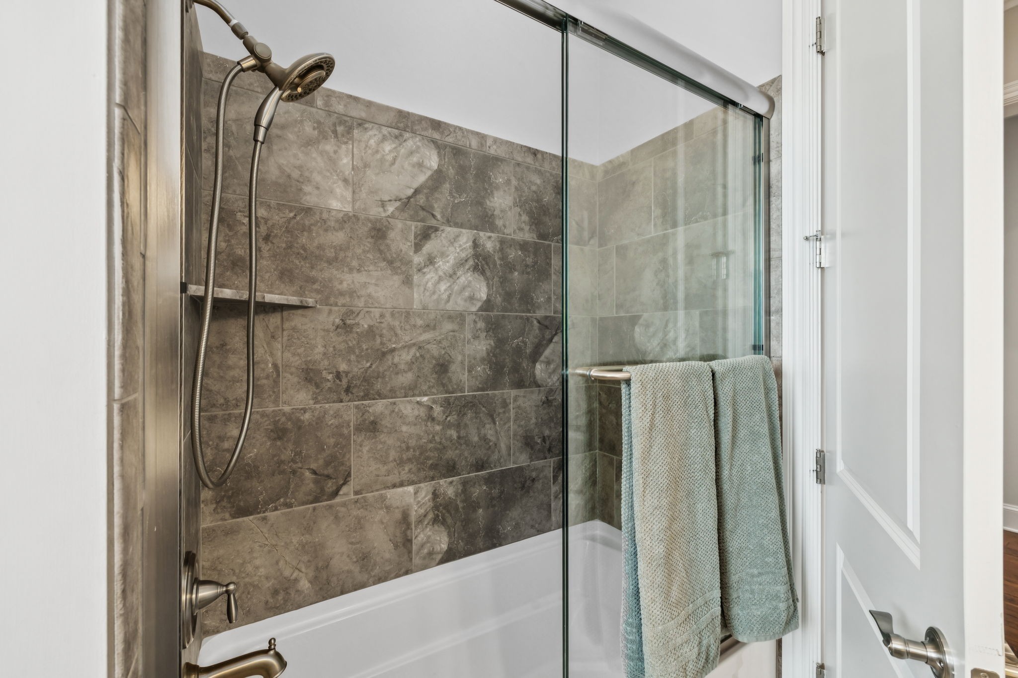 9080 Keats Street Franklin, TN 37064 - Photo 41 of 88 a bathroom with a shower and a glass door