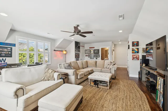 an aerial view of ocean and residential houses with outdoor space and lake view