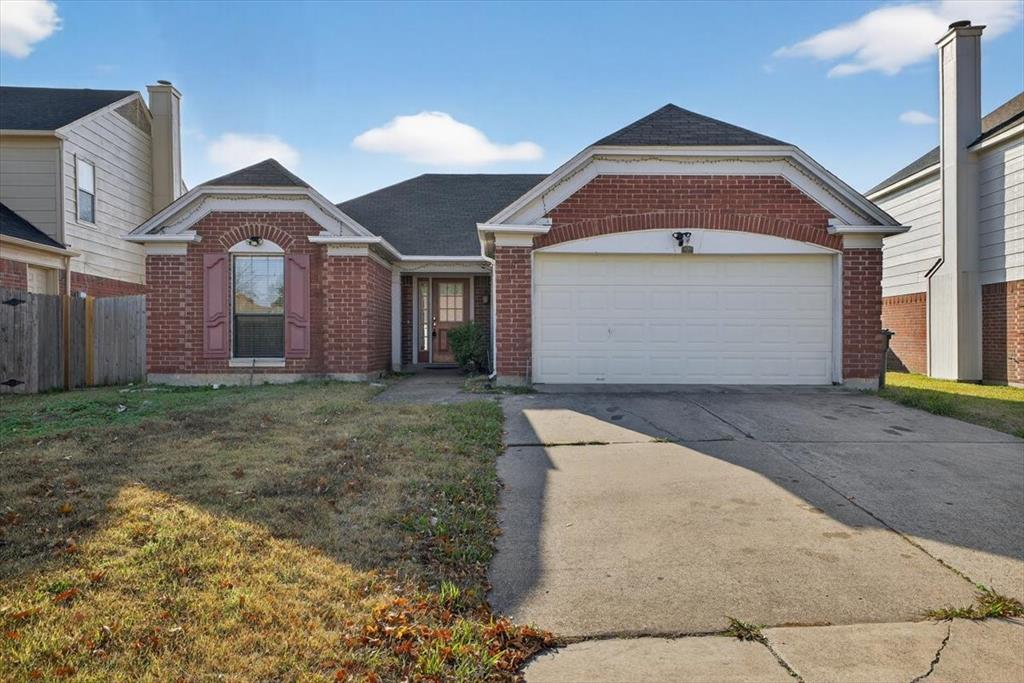 920 Danforth Place Arlington, TX 76017 - Photo 2 of 28 a front view of a house with a yard and garage