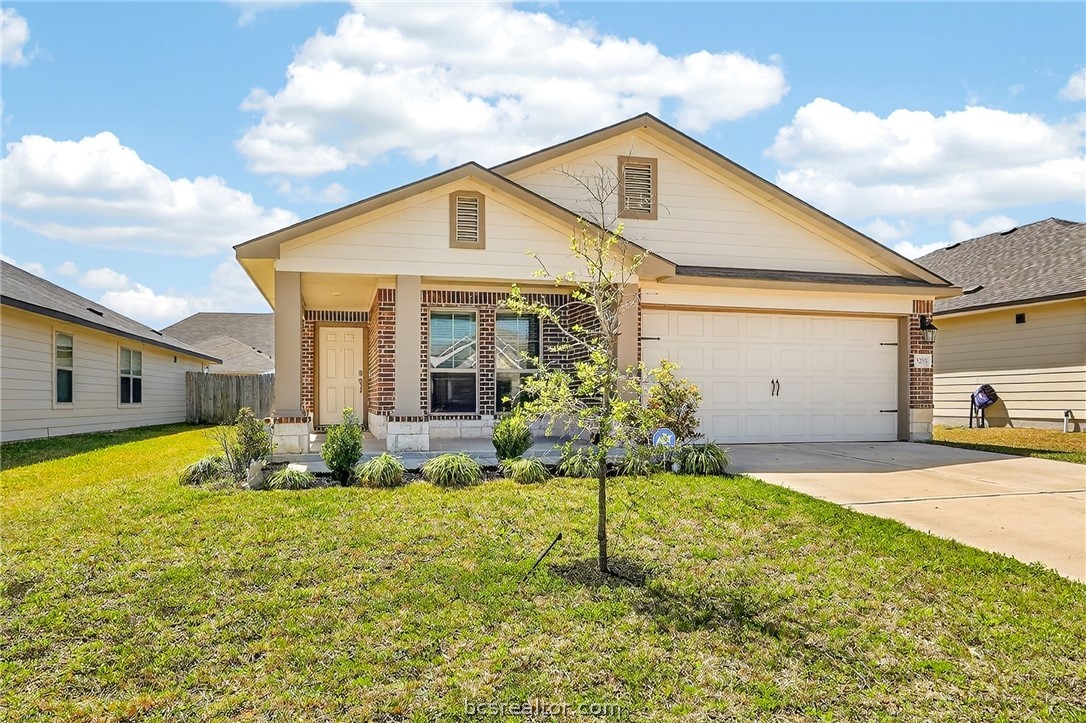 5235 Montague Loop Bryan, TX 77807 - Photo 1 of 25 a front view of house with yard