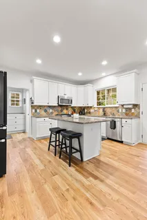 a bathroom with a granite countertop sink mirror and
