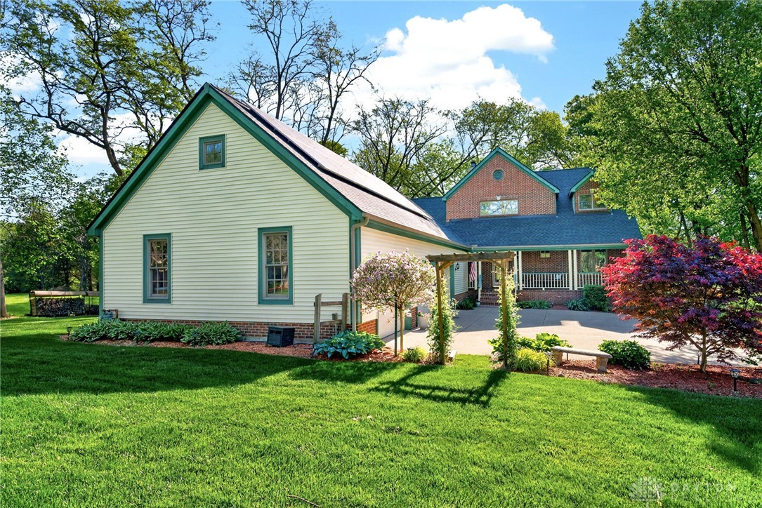 330 South Alpha Bellbrook Road Bellbrook, OH 45305 - Photo 79 of 87 This residence features a charming exterior with a spacious yard and ample outdoor living space.