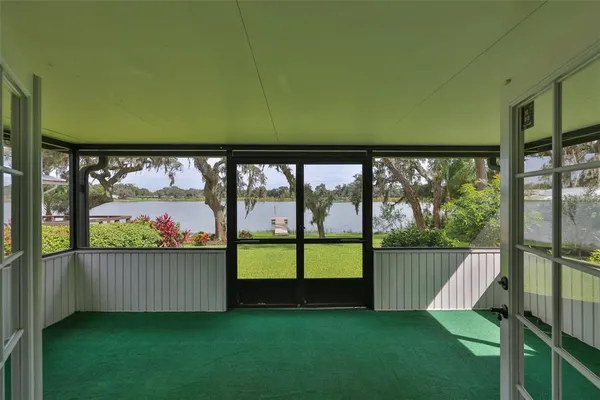 a view of a lake with houses in the background