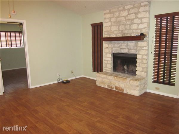 3603 Buffalo Springs Trail, Unit A Georgetown, TX 78628 - Photo 1 of 18 a view of empty room with wooden floor and fireplace