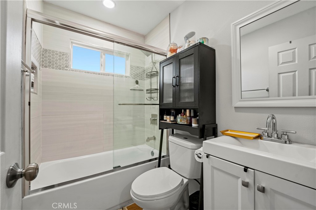 2117 West Corydon Street Compton, CA 90220 - Photo 18 of 40 a bathroom with a sink toilet and shower