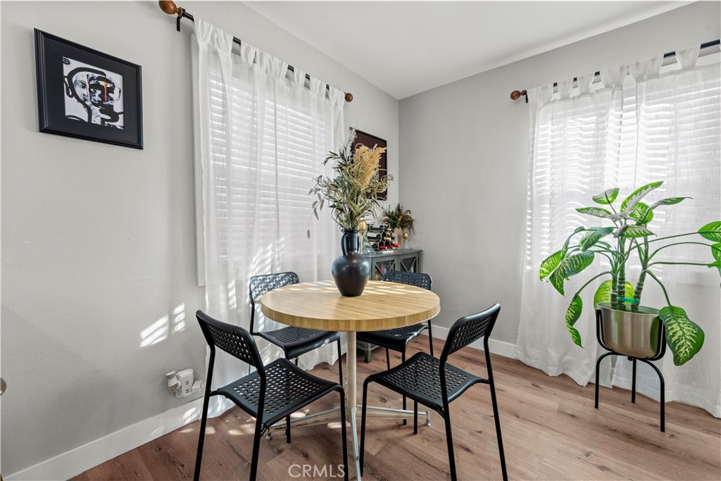 2117 West Corydon Street Compton, CA 90220 - Photo 28 of 40 a view of a dining room with furniture and a potted plant