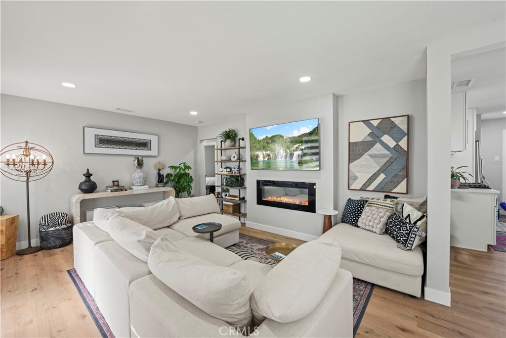 2117 West Corydon Street Compton, CA 90220 - Photo 5 of 40 a living room with furniture and a flat screen tv