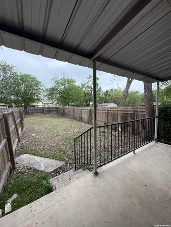 a view of backyard with green space