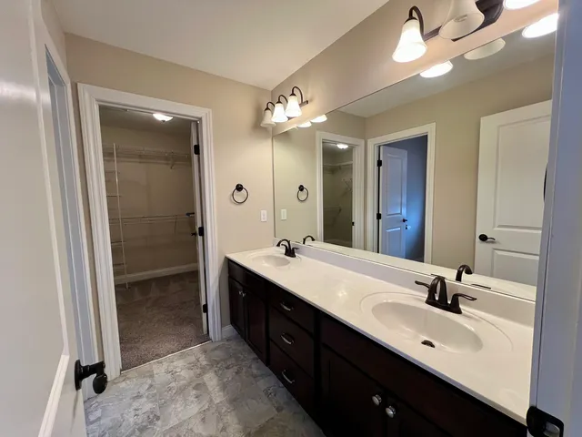 a bathroom with a toilet and shower
