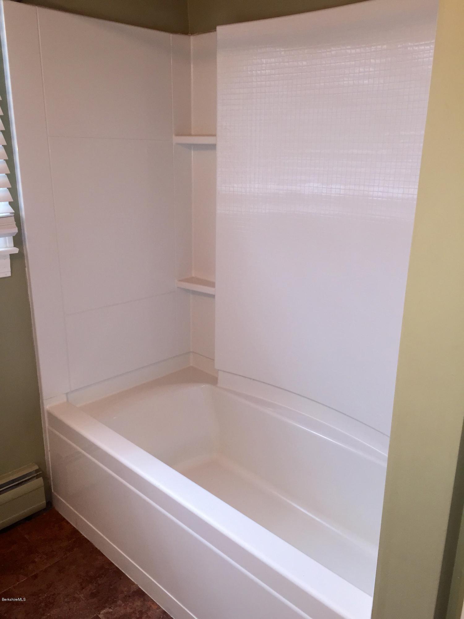 187 Swamp Road Richmond, MA 01201 - Photo 13 of 27 a bathroom with a bathtub
