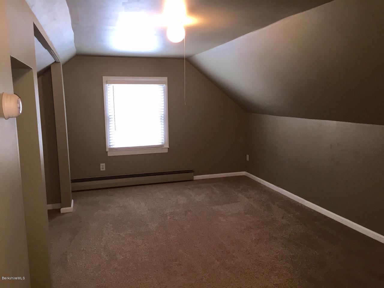 187 Swamp Road Richmond, MA 01201 - Photo 17 of 27 a view of an empty room with a window