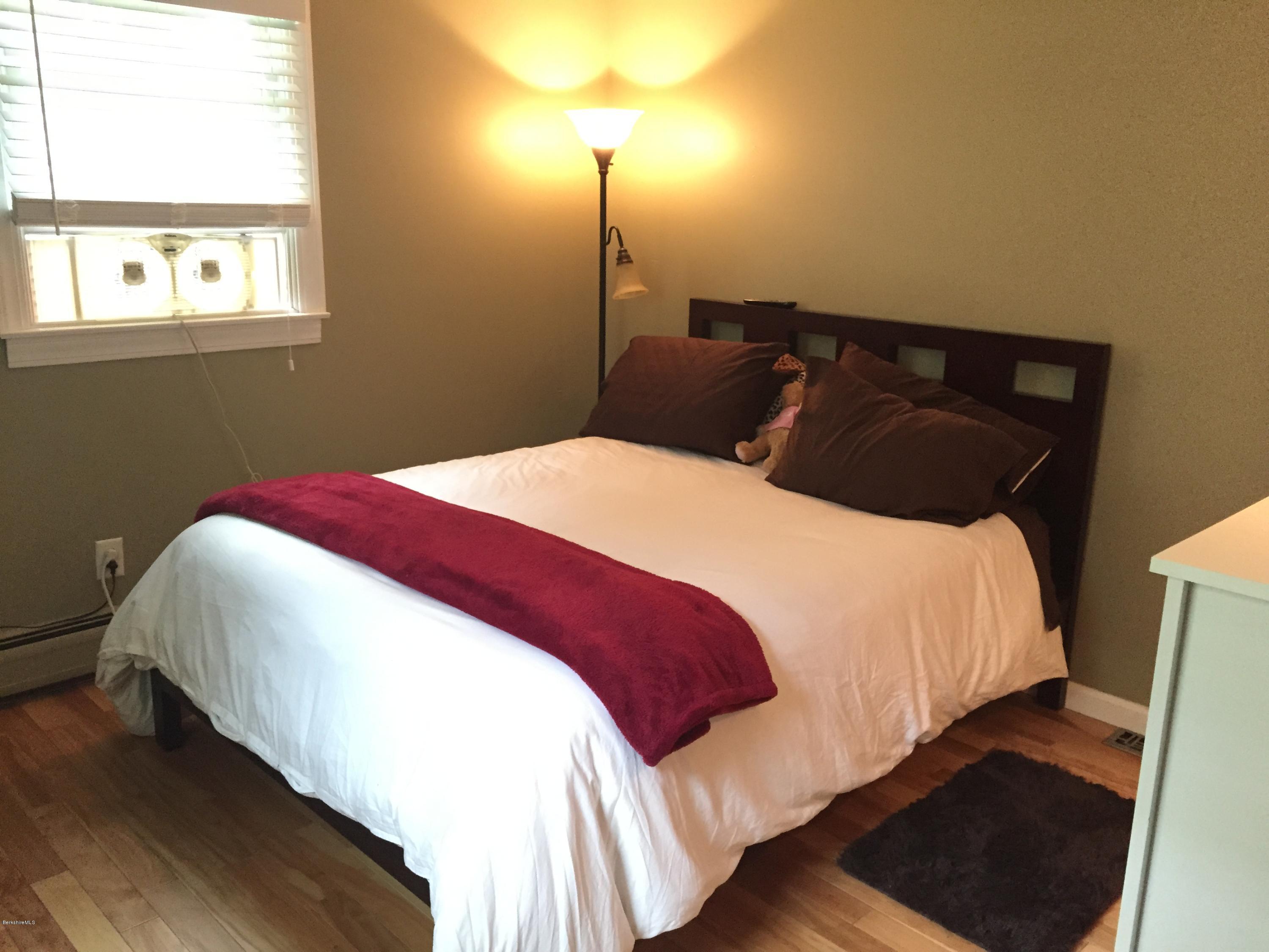 187 Swamp Road Richmond, MA 01201 - Photo 19 of 27 a bedroom with a bed and a window