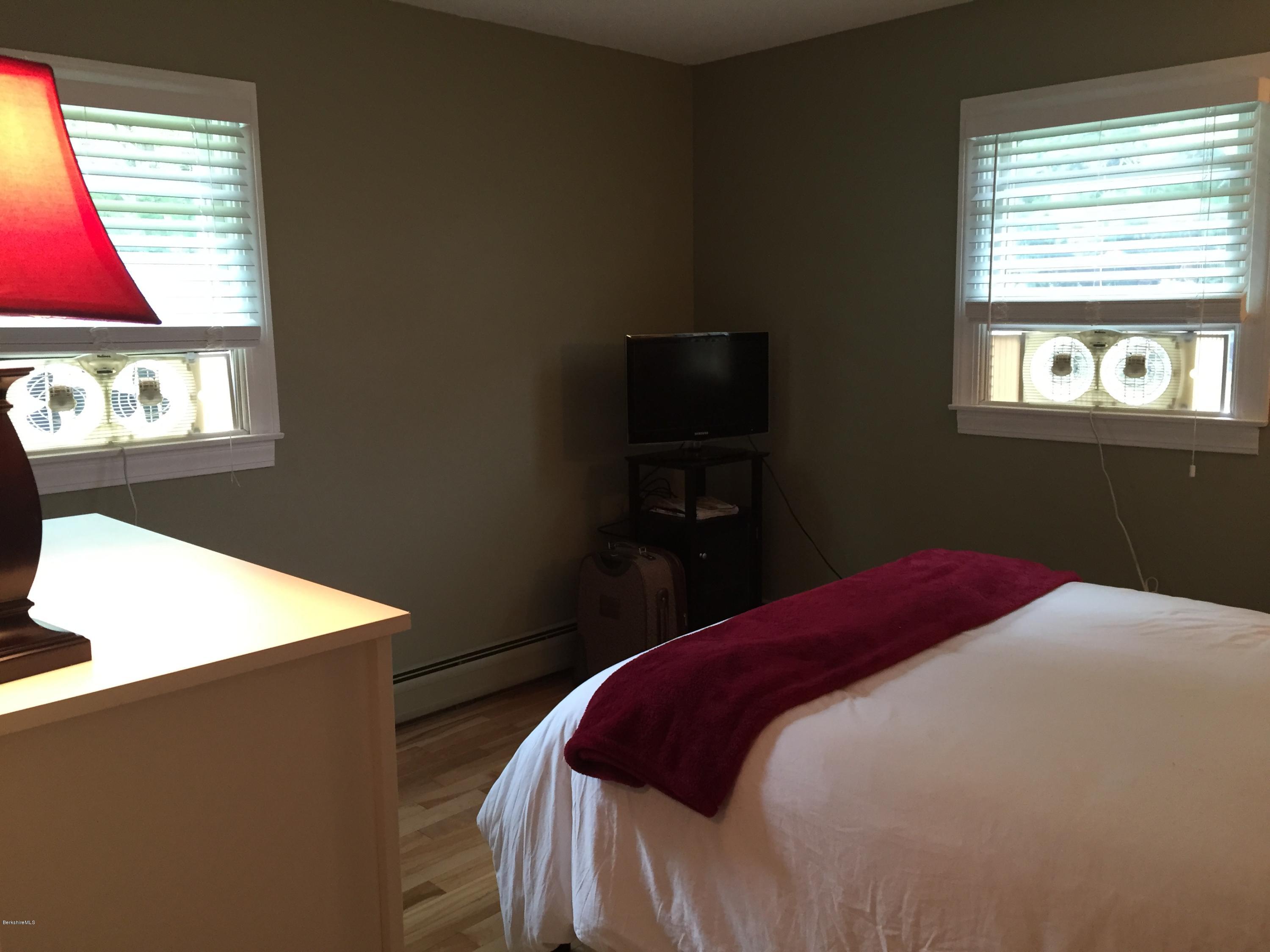 187 Swamp Road Richmond, MA 01201 - Photo 20 of 27 a bedroom with a bed and a window