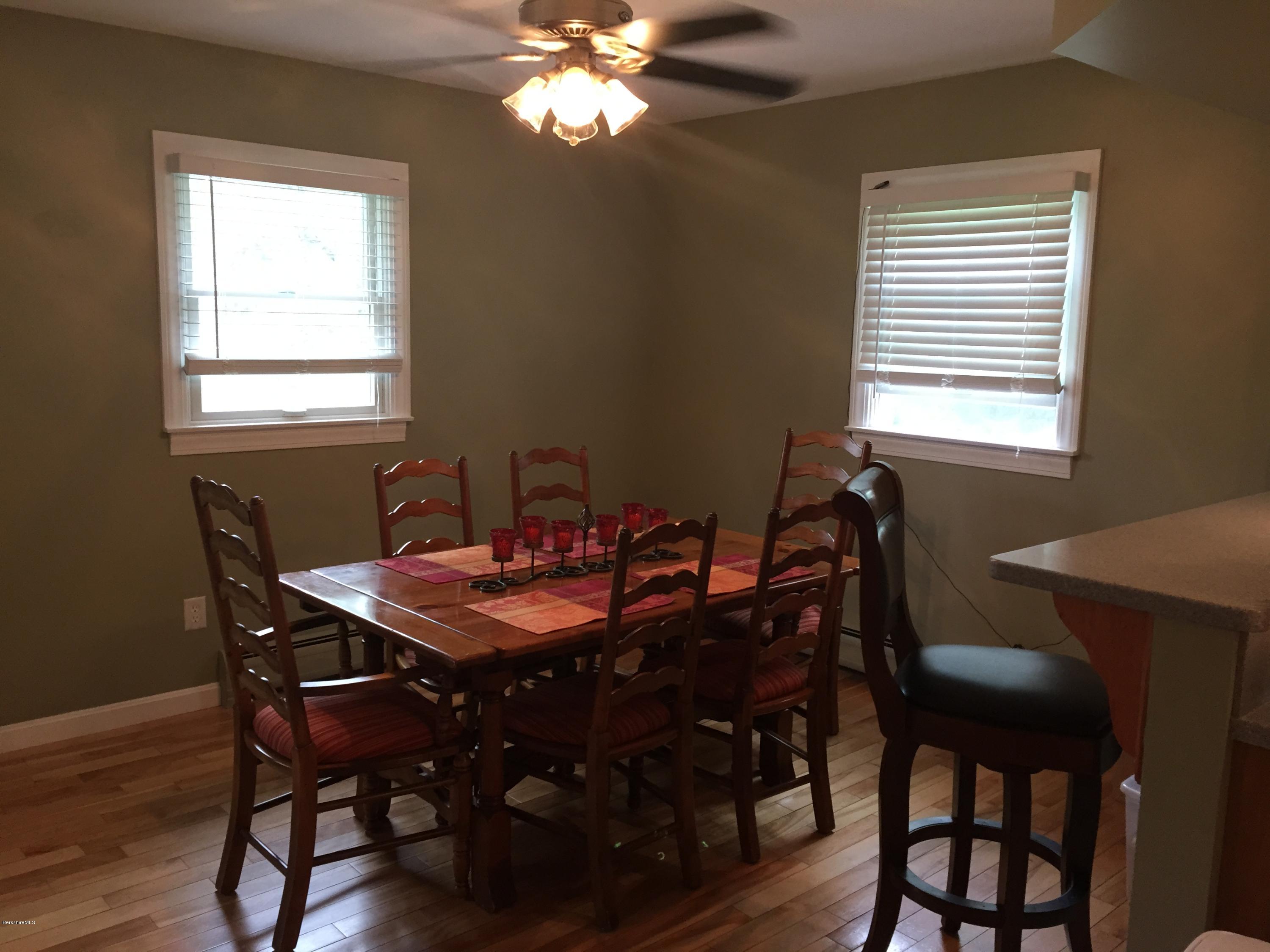 187 Swamp Road Richmond, MA 01201 - Photo 21 of 27 a view of a dining room with furniture and wooden floor
