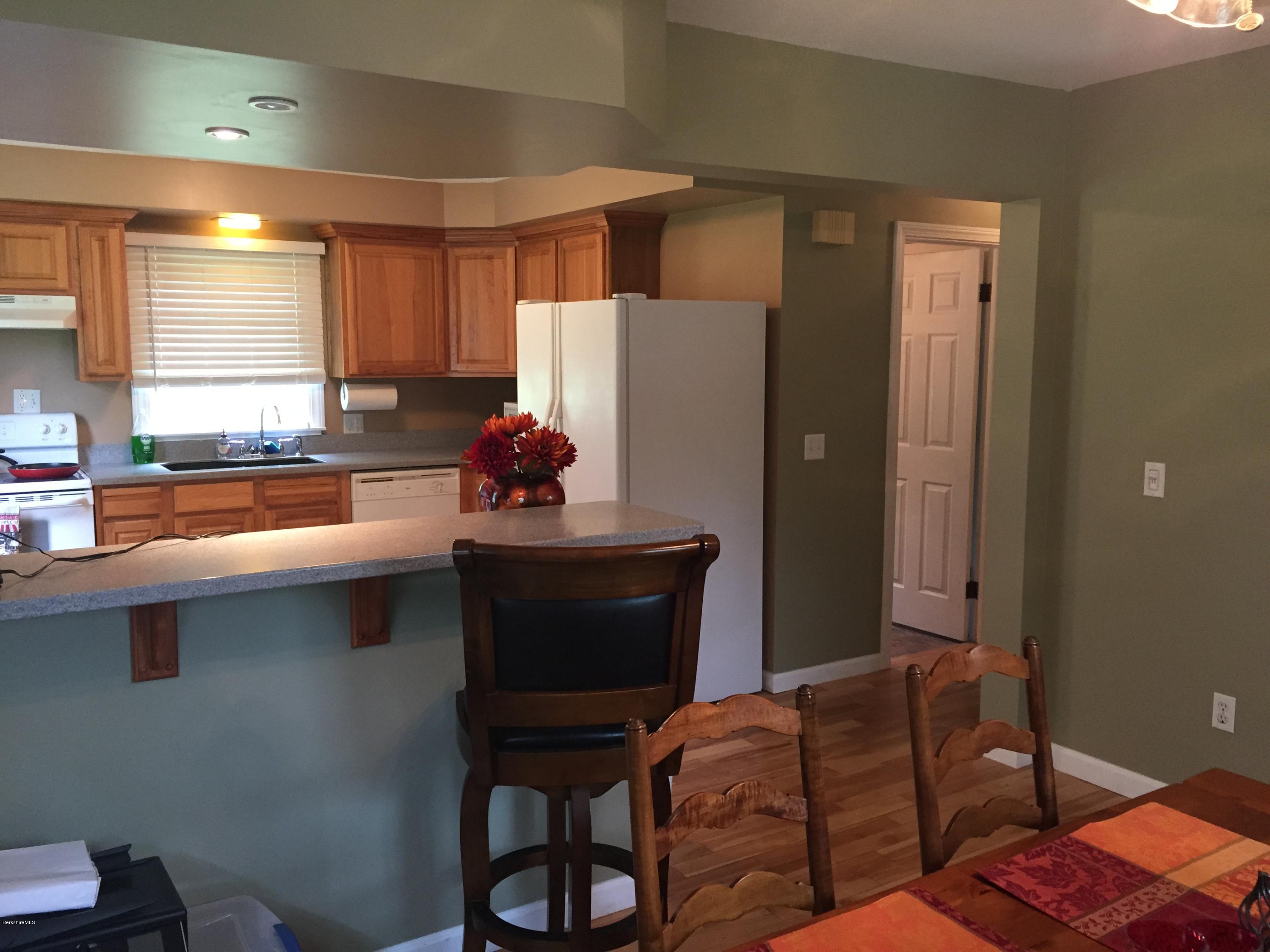 187 Swamp Road Richmond, MA 01201 - Photo 26 of 27 a kitchen with stainless steel appliances granite countertop a refrigerator and a sink