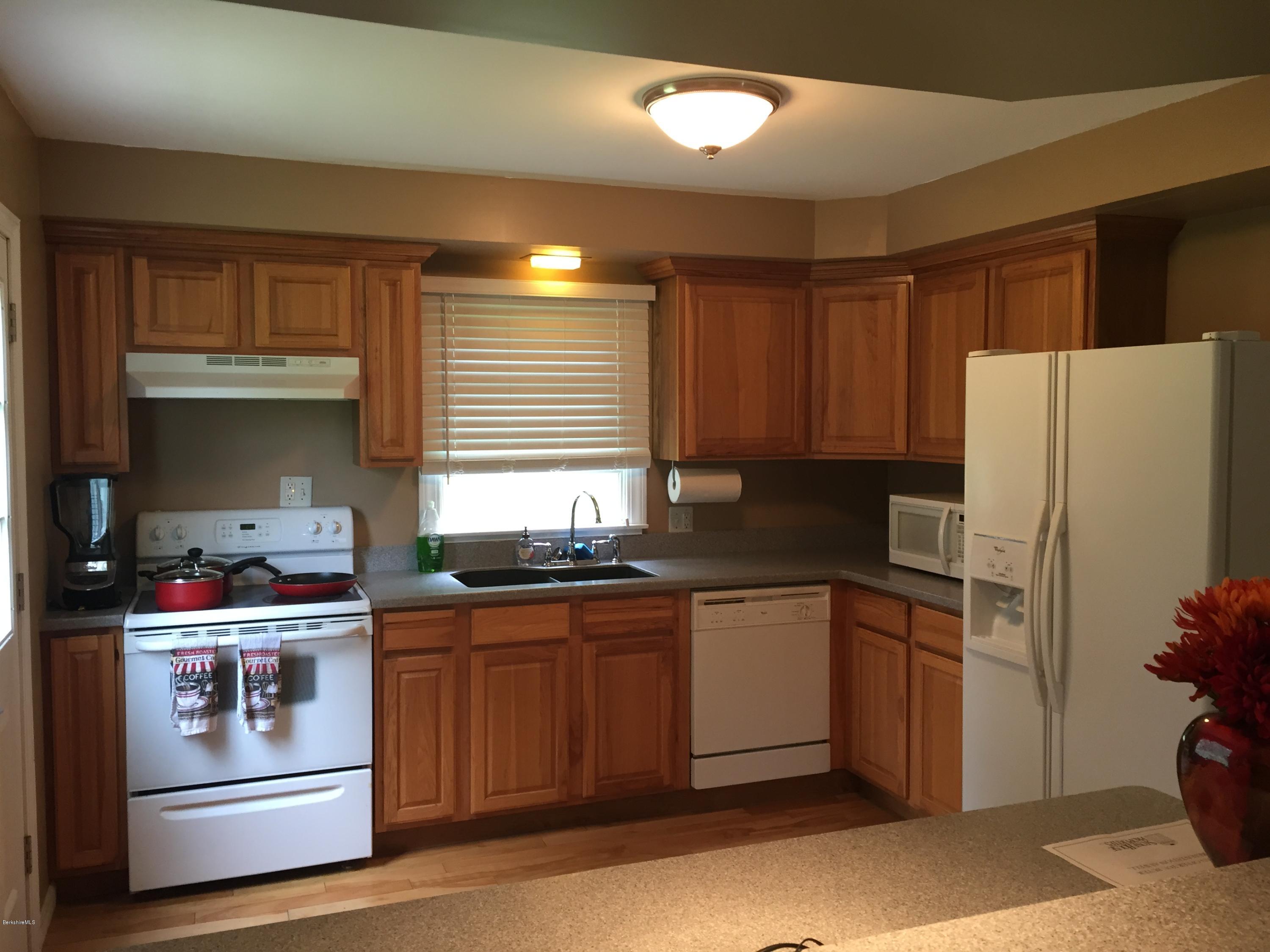 187 Swamp Road Richmond, MA 01201 - Photo 27 of 27 a kitchen with stainless steel appliances granite countertop a stove a refrigerator and a sink