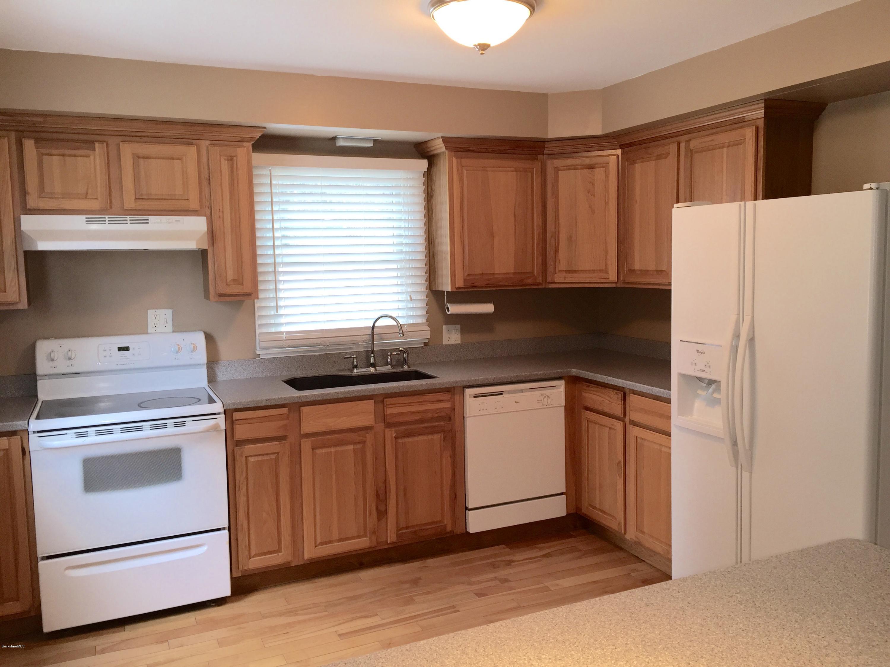187 Swamp Road Richmond, MA 01201 - Photo 8 of 27 a kitchen with granite countertop cabinets stainless steel appliances and a sink