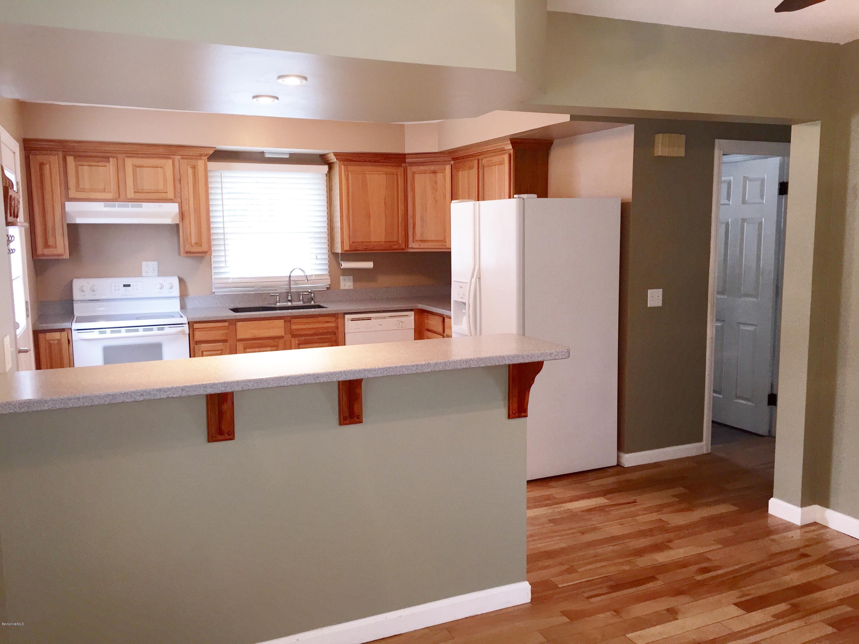 187 Swamp Road Richmond, MA 01201 - Photo 9 of 27 a kitchen with stainless steel appliances a refrigerator and a stove