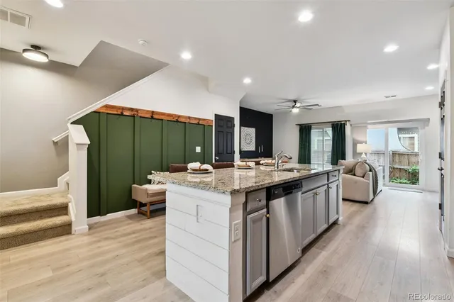 a kitchen with sink and cabinets