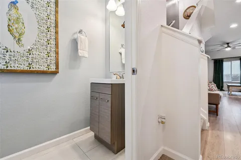 a bathroom with a shower and a sink