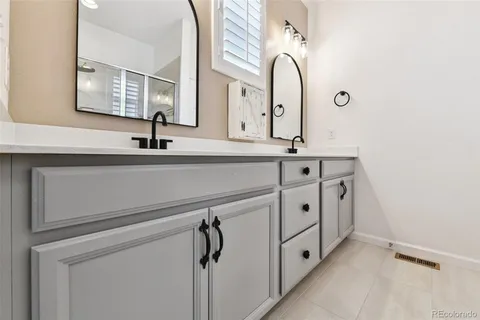 a view of cabinets and tap