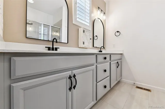 a view of cabinets and tap