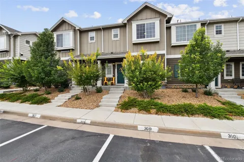 a view of a house with a yard and plants