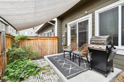 an outdoor sitting area with furniture