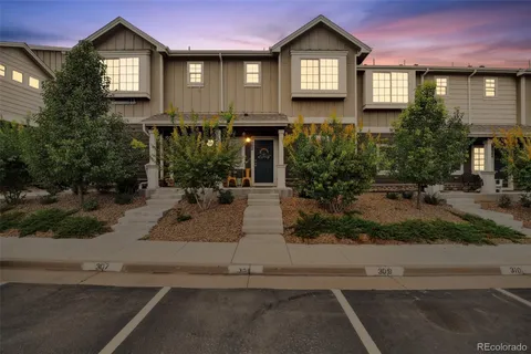a front view of a house with yard