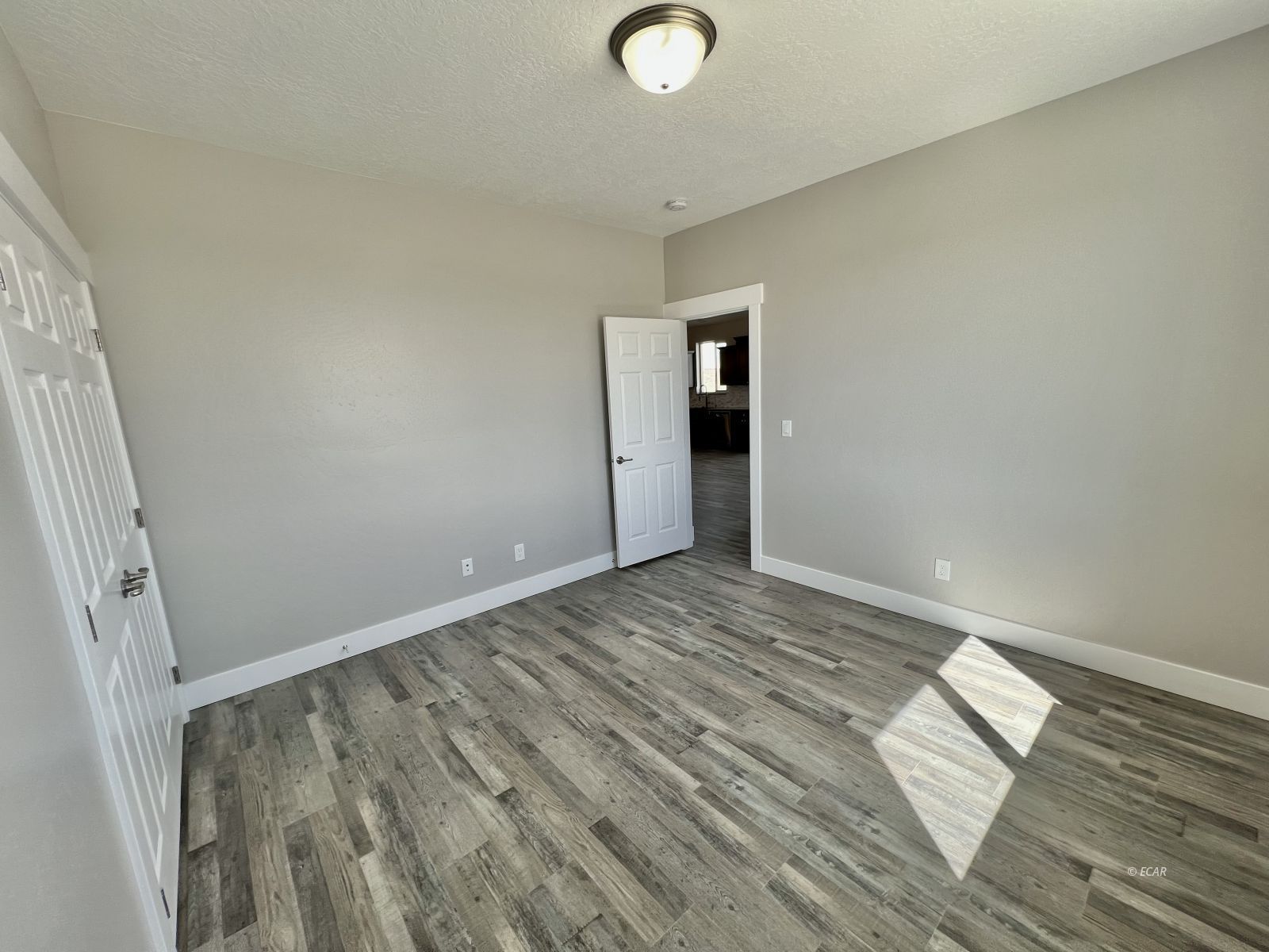 1151 Sun Vly Road Spring Creek, NV 89815 - Photo 15 of 30 a view of empty room with wooden floor