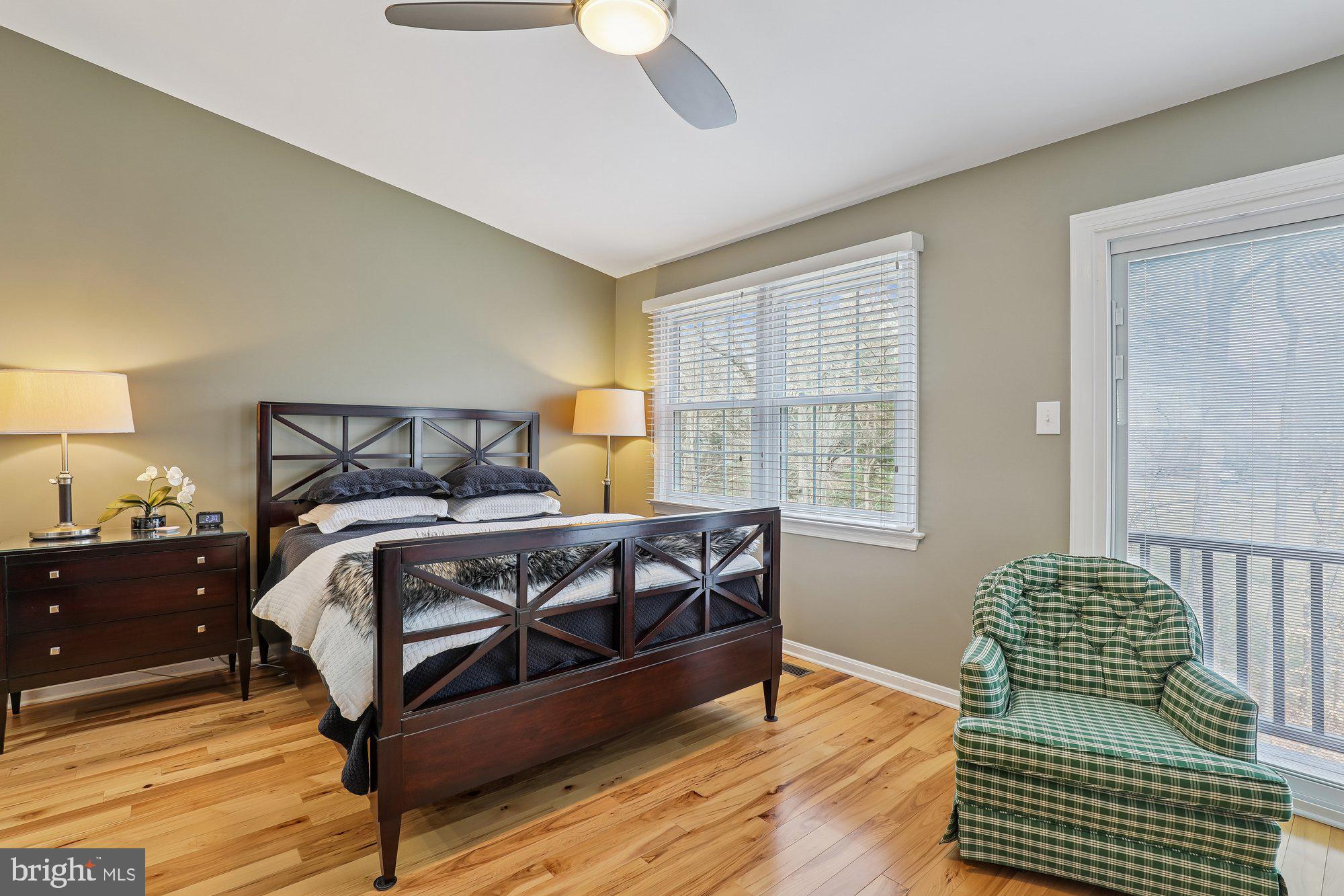 8019 Galla Knoll Circle Springfield, VA 22153 - Photo 27 of 57 a bedroom with a bed and wooden floor