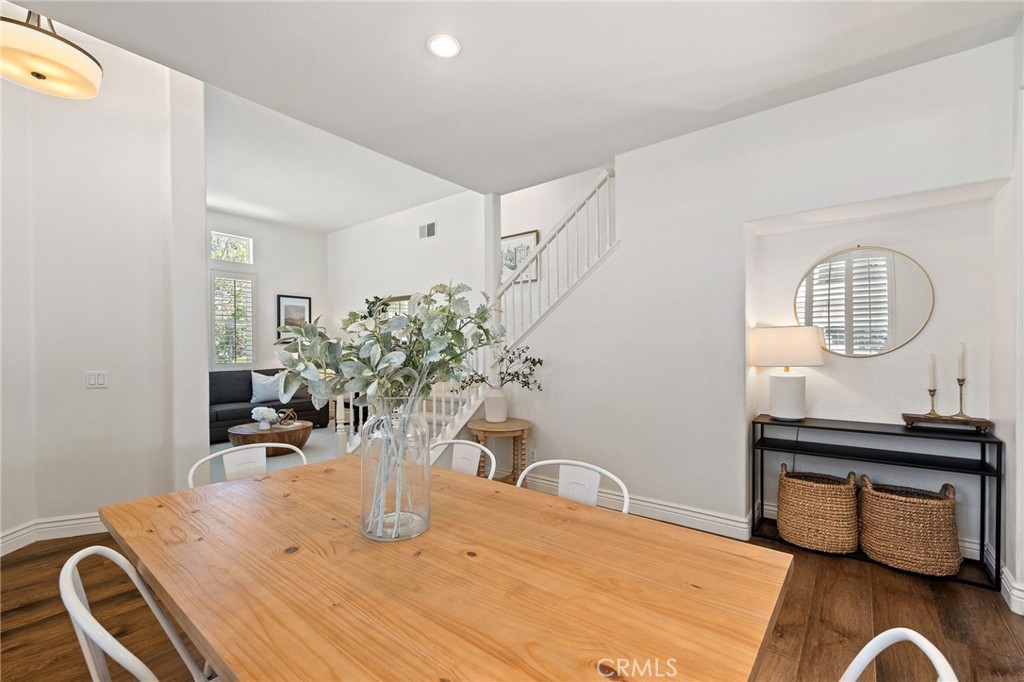 8 Danbury Ladera Ranch, CA 92694 - Photo 10 of 57 a table with a potted plant on a table and a mirror