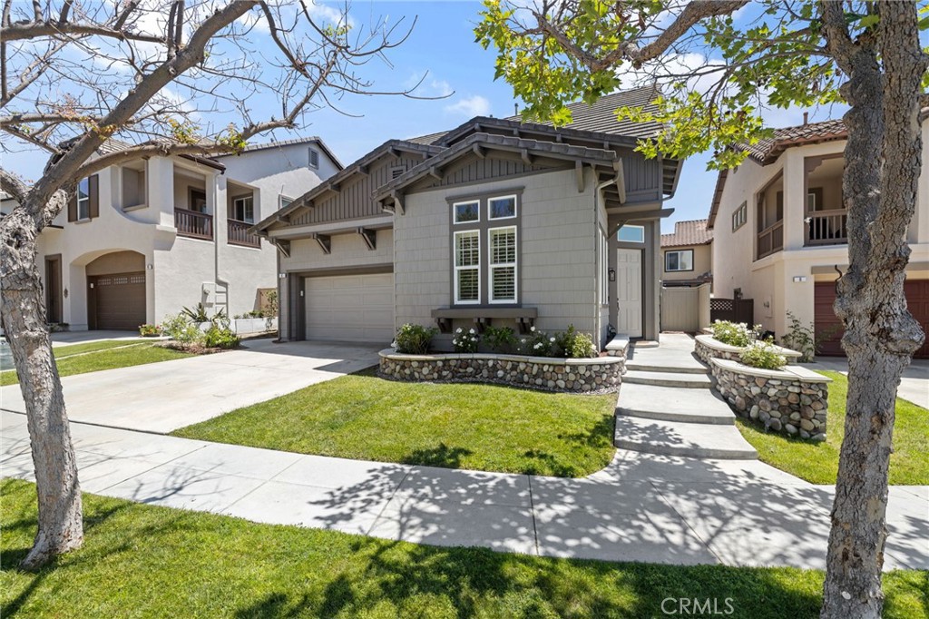 8 Danbury Ladera Ranch, CA 92694 - Photo 1 of 57 a front view of a house with a garden and patio