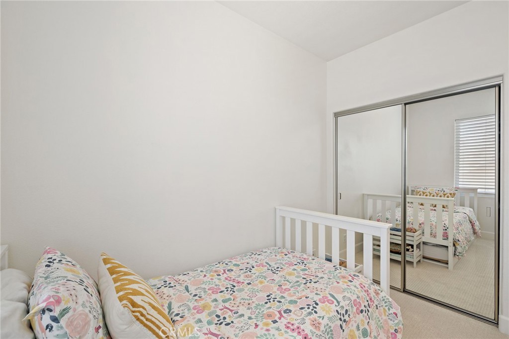 8 Danbury Ladera Ranch, CA 92694 - Photo 23 of 57 a bedroom with a bed a couch and a window