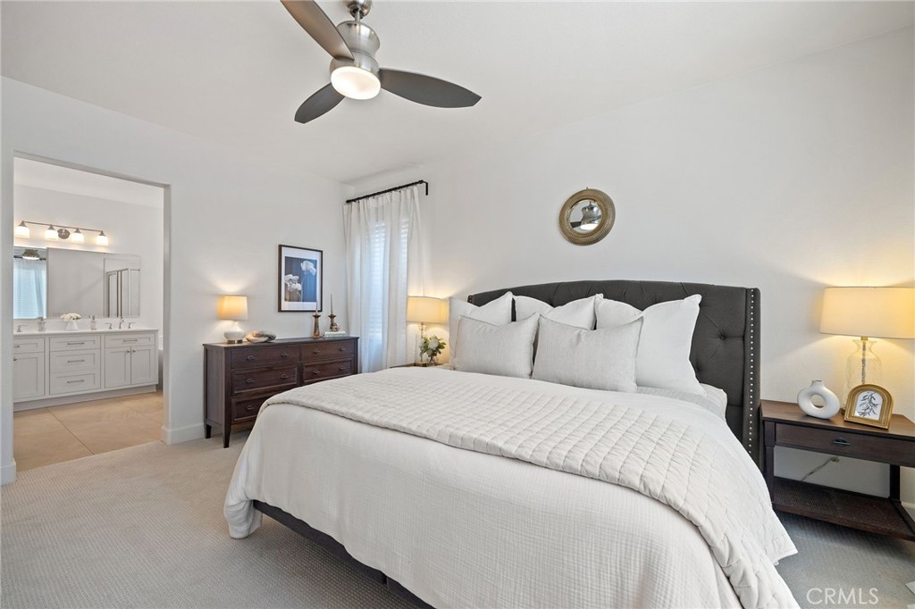 8 Danbury Ladera Ranch, CA 92694 - Photo 31 of 57 a bedroom with a bed and a lamp