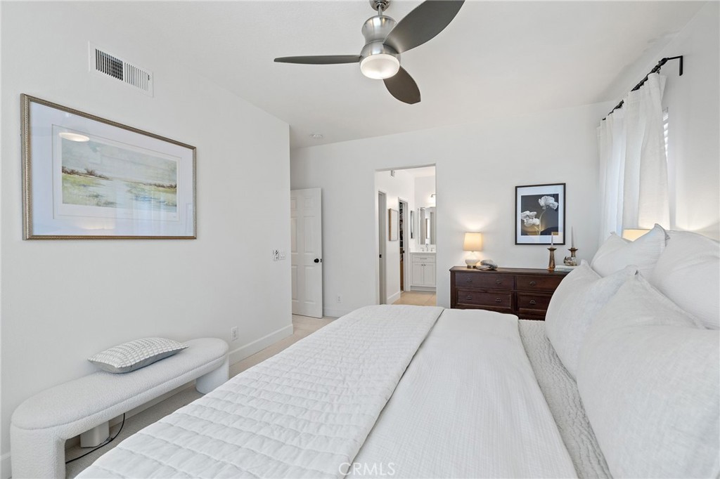 8 Danbury Ladera Ranch, CA 92694 - Photo 32 of 57 a bedroom with a large bed and a chandelier