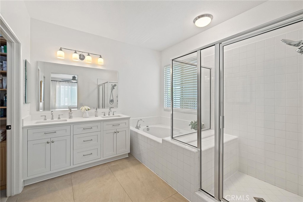 8 Danbury Ladera Ranch, CA 92694 - Photo 33 of 57 a spacious bathroom with a tub shower and sink
