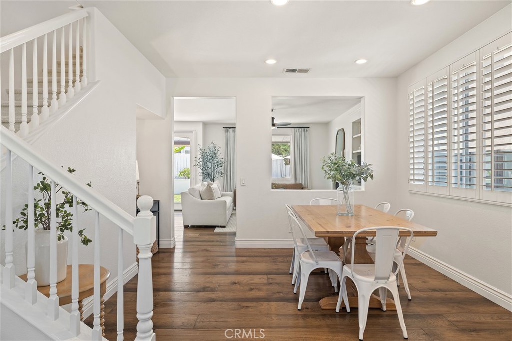 8 Danbury Ladera Ranch, CA 92694 - Photo 9 of 57 a dining room with furniture wooden floor and a chandelier