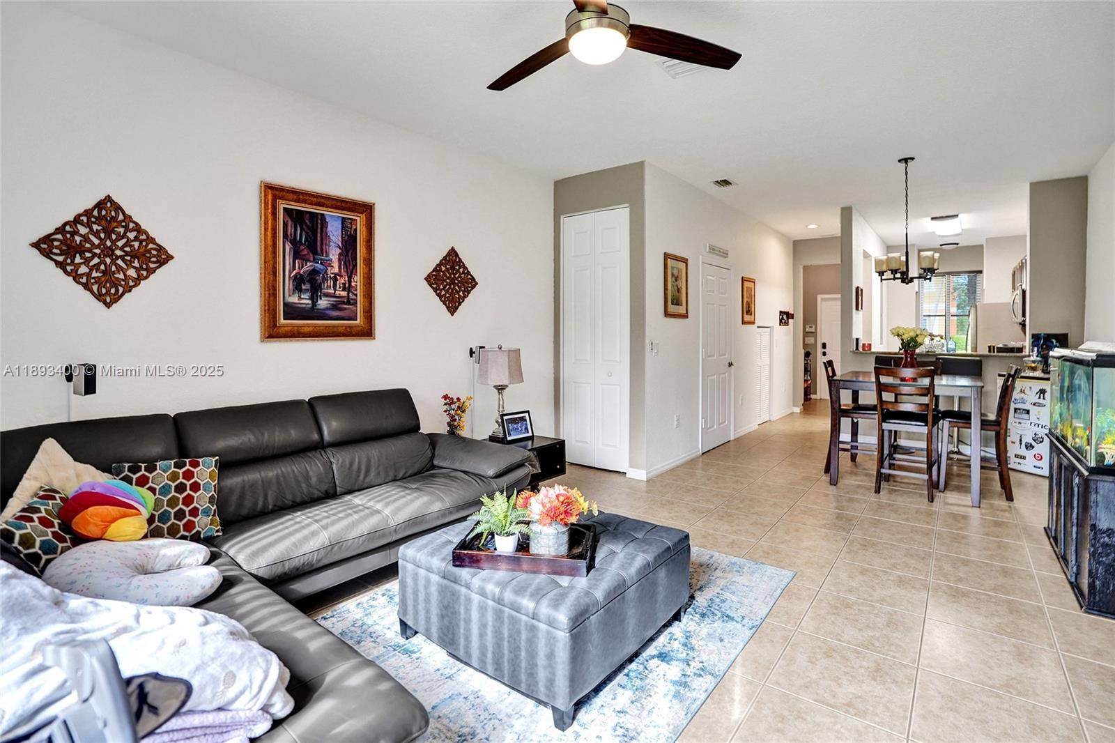 1832 Southwest 89th Terrace Miramar, FL 33025 - Photo 11 of 28 a living room with furniture and a dining table