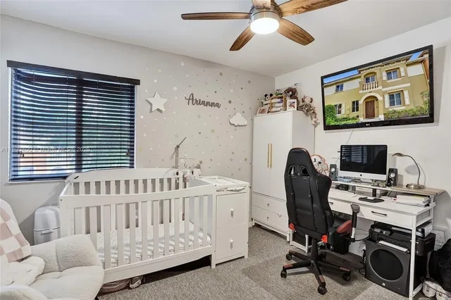 a bedroom with furniture and a window