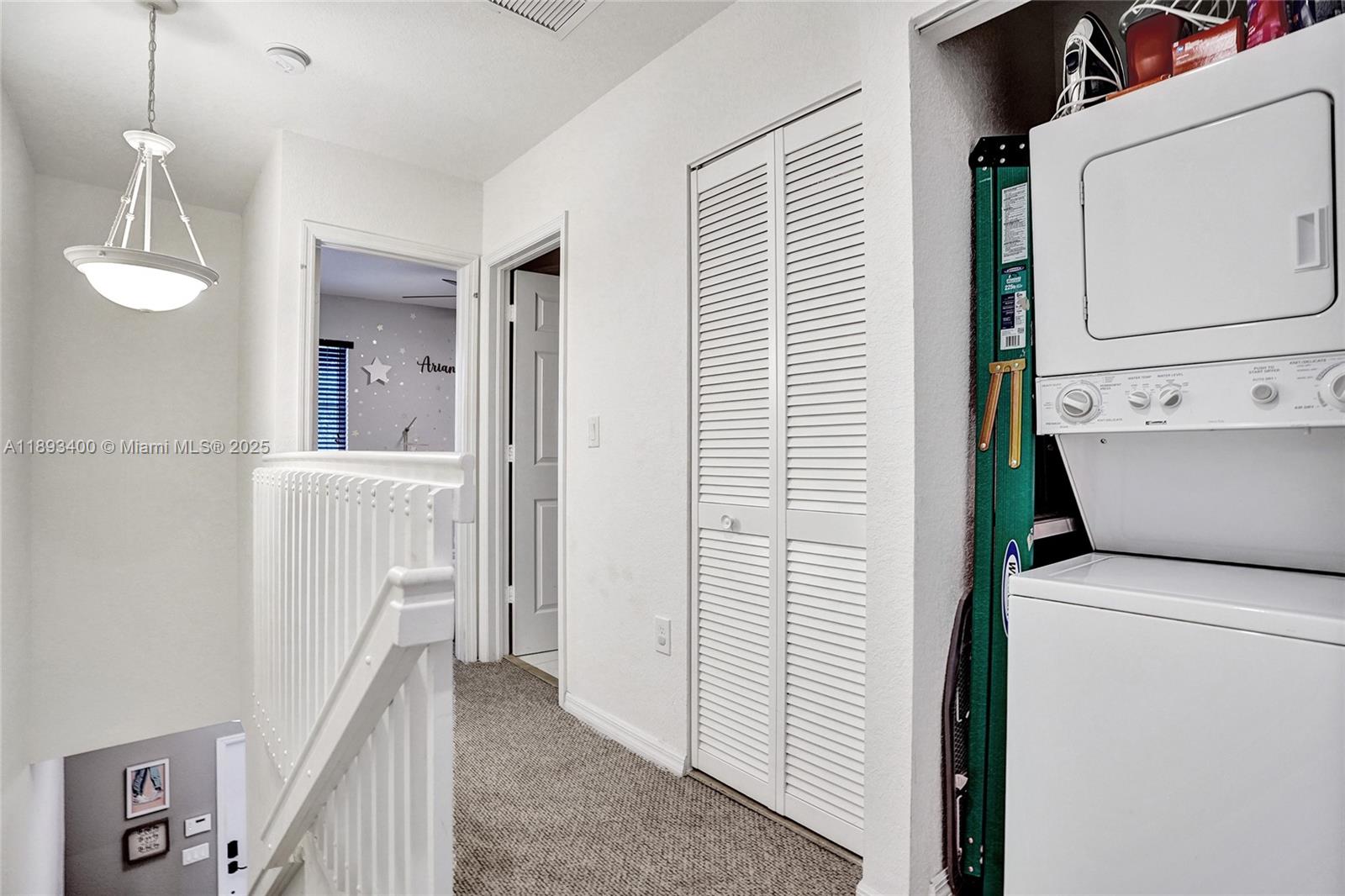 1832 Southwest 89th Terrace Miramar, FL 33025 - Photo 17 of 28 a view of a hallway with washer and dryer