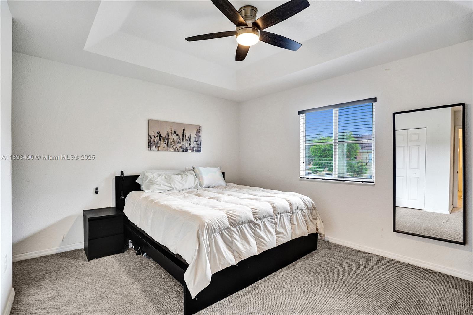 1832 Southwest 89th Terrace Miramar, FL 33025 - Photo 19 of 28 a bedroom with a large bed and a window