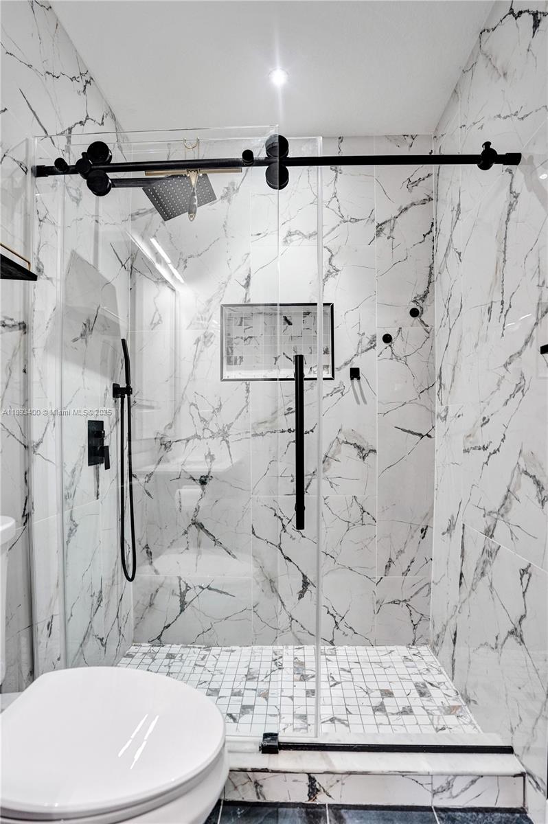 1832 Southwest 89th Terrace Miramar, FL 33025 - Photo 22 of 28 a bathroom with a sink and mirror