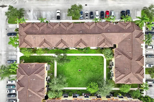 an aerial view of a house with a garden