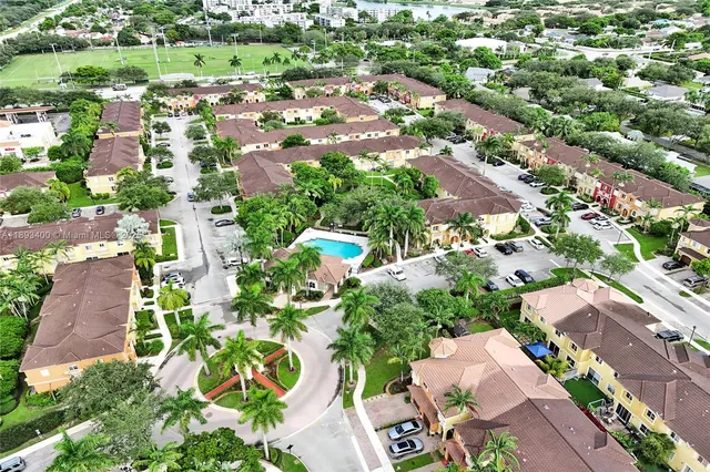 an aerial view of residential houses with outdoor space